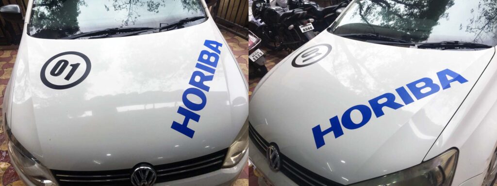 Plotter cut vinyl logo and letters used for car branding a company vehicle. Front and side view of the Horiba car bonnet displaying the car graphics pasted on the same
