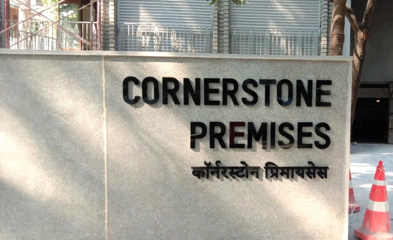 WPC sheet with black acrylic cut letters to create a sign of the Cornerstone building on Prabhat Road Pune