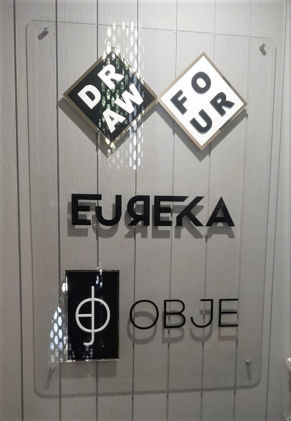 acrylic name board for the EUREKA company made of clear acrylic base plate and laser cut logos and letters fixed on top