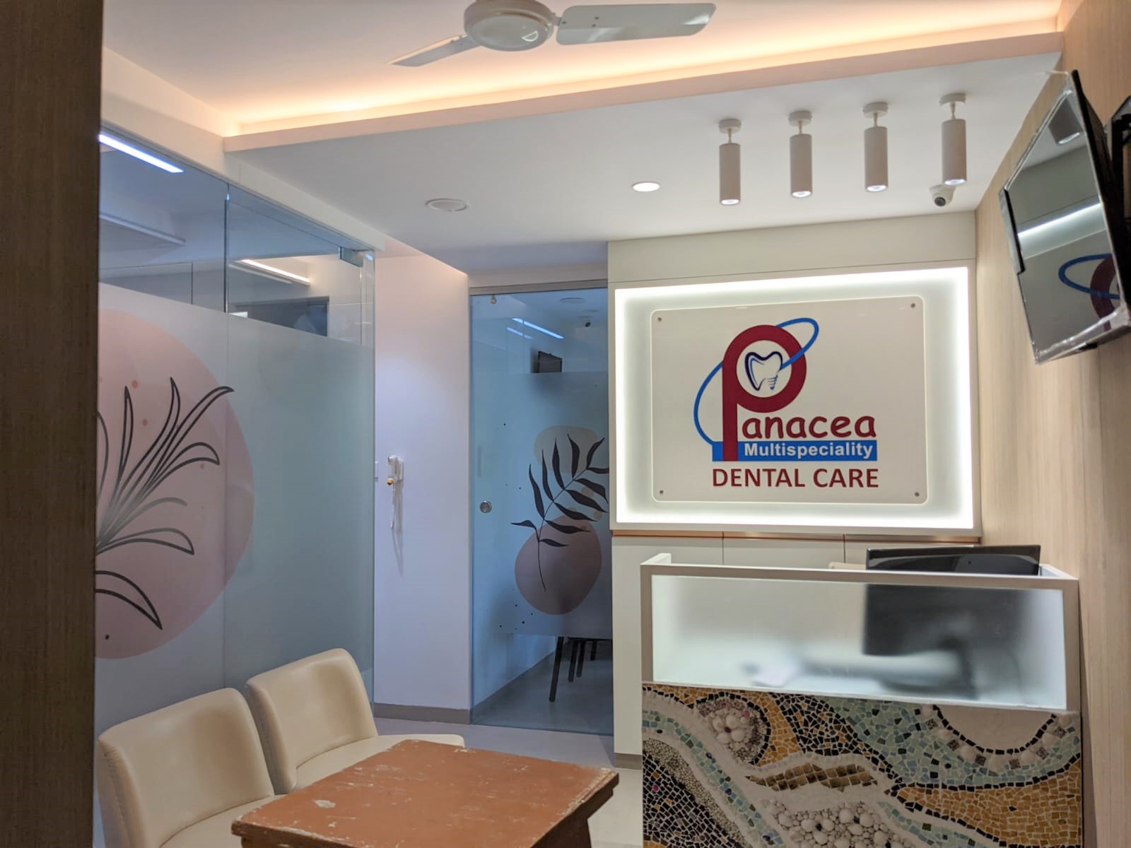 non lit acrylic logo board installed in the lobby of dr natu's panacea dental clinic
