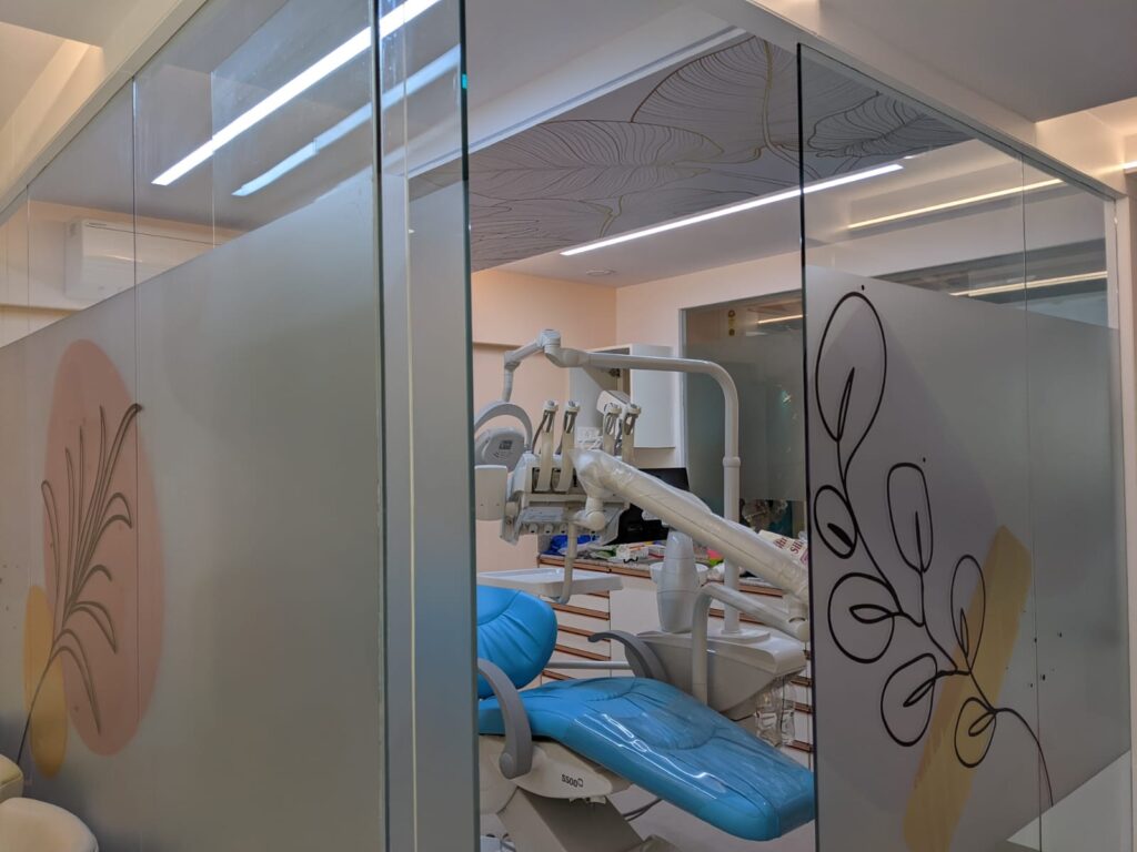 Custom printed frosted glass films pasted on the partitions of the inside cabins of a dental click to make the interiors look classy and protect the privacy of the patient as well 