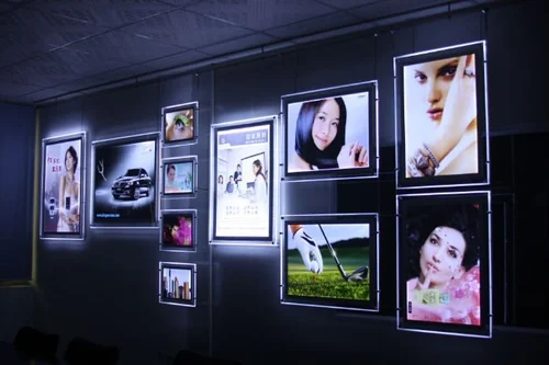Multiple LED photo frames installed on a wall will work wonders for your office interiors