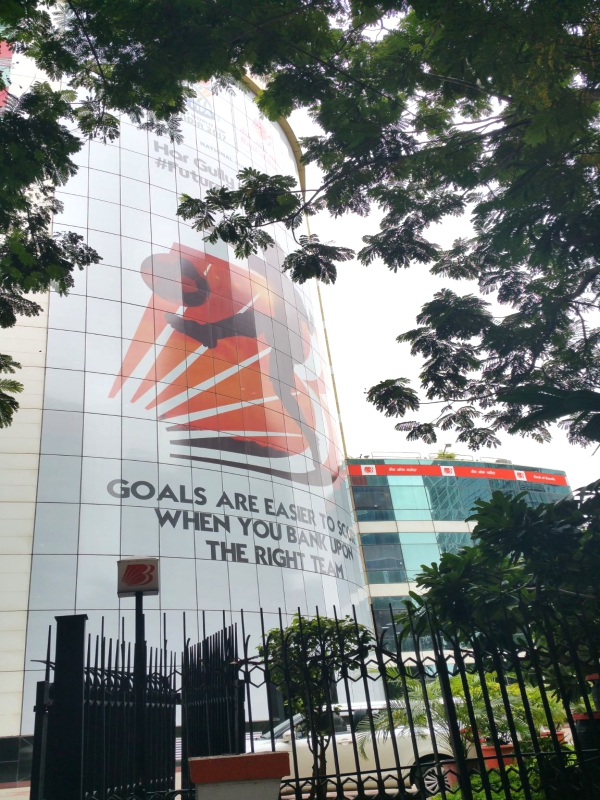 Avery Dennison™ 7000 series One way vision with DOL1060z clear gloss lamination all weather prints used to brand the entire front facade of a tall commercial building at the Bandra Kurla Complex