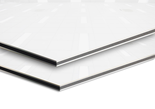 Side view of two glossy white ACP sheets stacked one on top of another