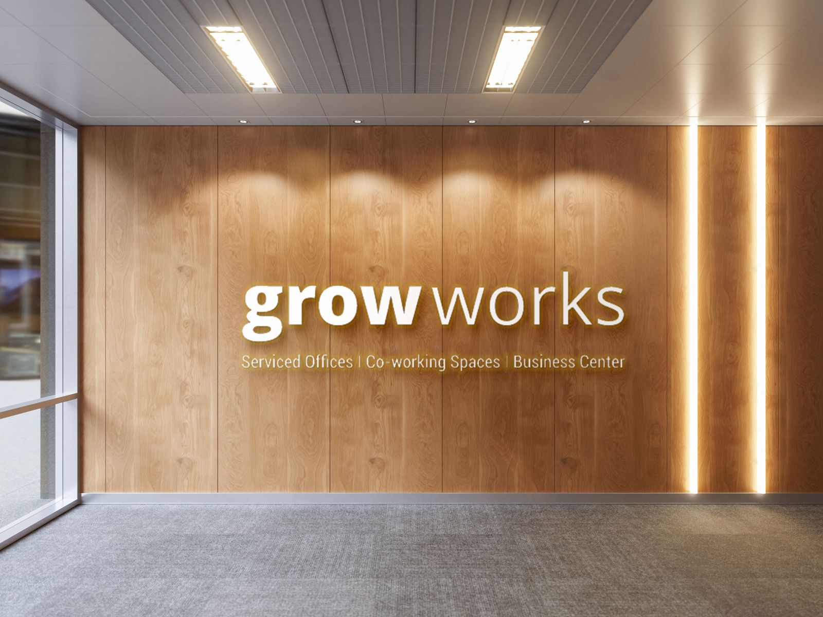 White colored laser-cut acrylic logo for the Grow Works company fixed on a wooden wall inside their office