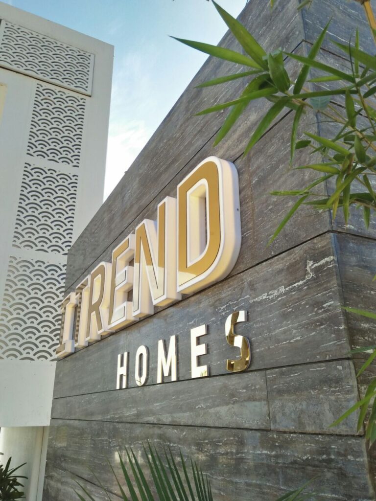 The 'I-Trend' logo is cut from white acrylic with a gold acrylic sheet stuck on the front face of the neon sign. The letters are manufactured with a depth of approximately three inches to create a raised 3D effect to the entire sign board.