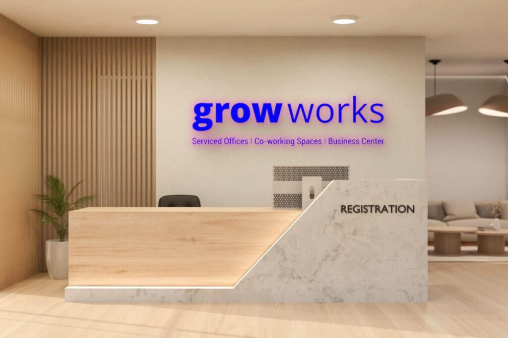 Stand alone logo sign laser cut from blue acrylic sheets and lit with brightly glowing LEDs installed in the GROW WORKS office reception area to enhance their office interiors.