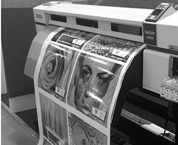 A wide format printing machine printing out a large sized high resolution photograph