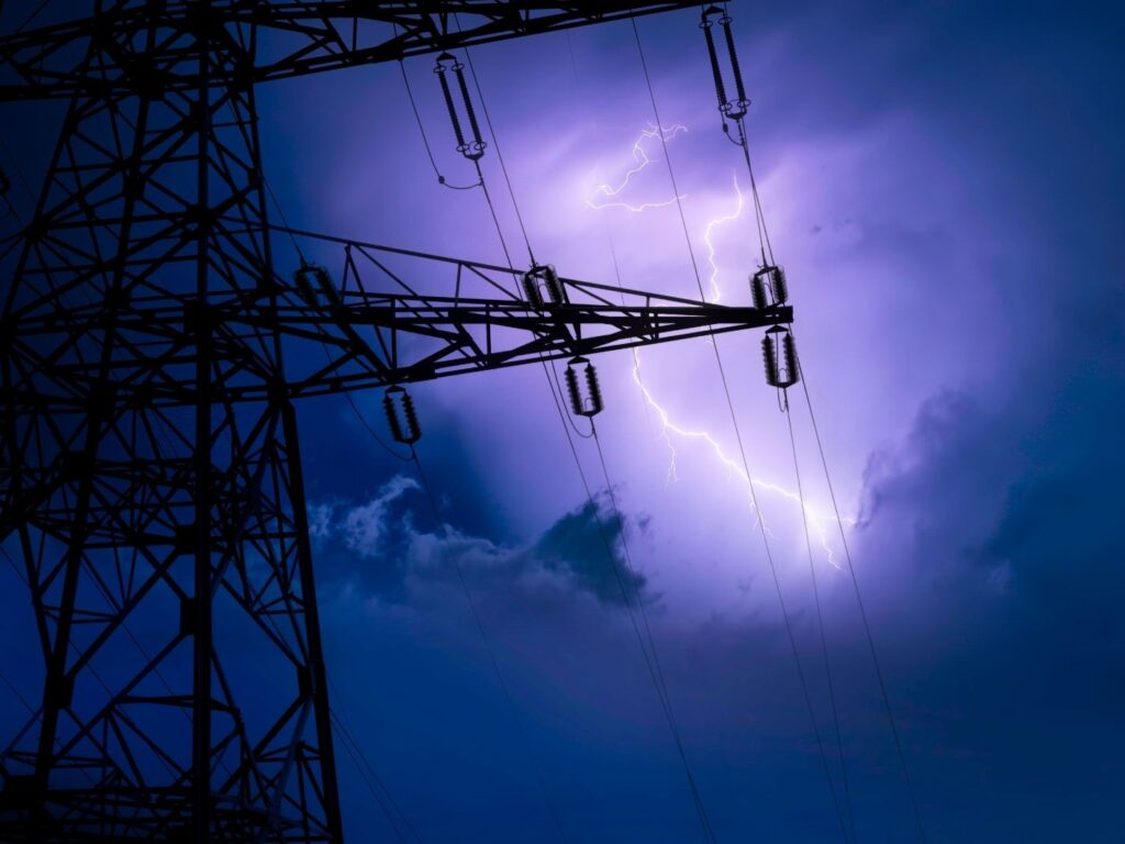 High voltage transmission tower in a lightning storm