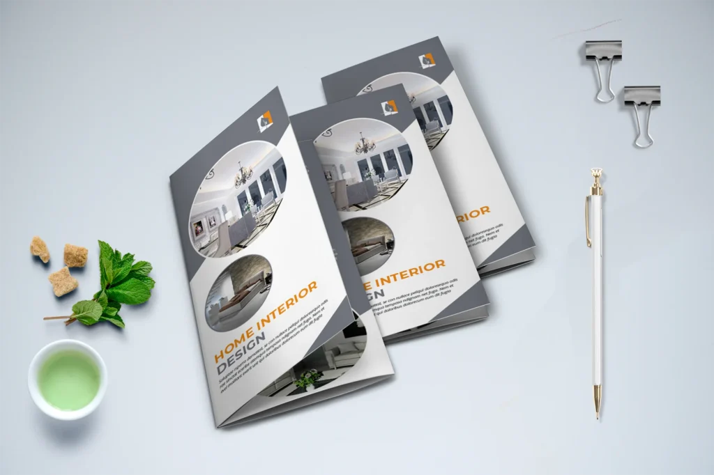 A home interior company's three trifold brochures on a desk