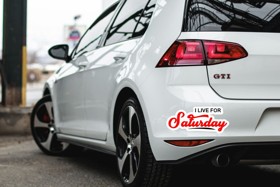 A bumper sticker pasted on the rear of a car the sticker is weatherproof and night reflective