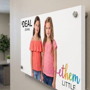 A product poster of a clothing company printed on a thick plastic sheet wood plastic composite sheet installed on a wall inside an office using mirror cap screws and stand off mounts