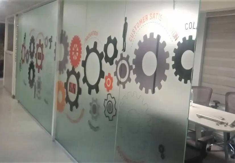 frosted-glass-film-print-showing-images-of-gears-pasted-on-the-cabin-partition-of-a-large-office.jpg[1]