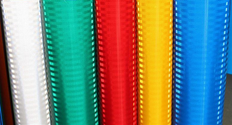 Multi-coloured rolls of 3M brand high intensity prismatic vinyl films stacked next to each other