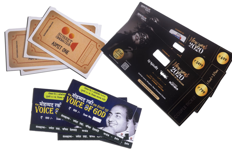 three event tickets digitally printed on a colour printer and spread out for display