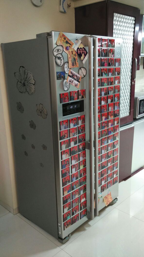 an entire fridge door covered by custom printed fridge magnets