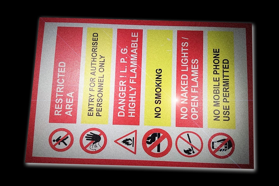 A road sign printed on a glass beaded reflective vinyl material. These glass beads brightly reflect light to make the prints visible at night or in low light conditions