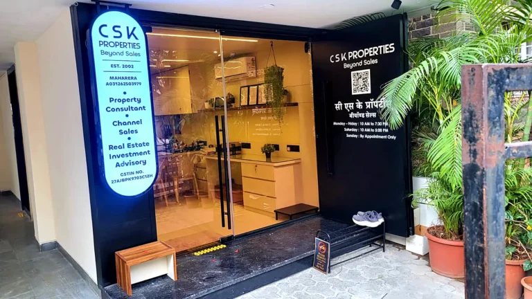 Wide view of the CSK office front with the hanging LED sign