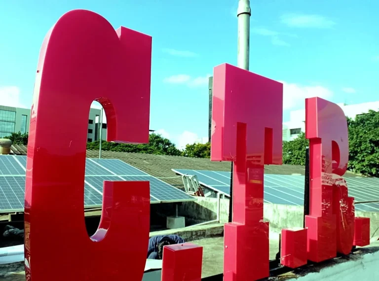 C.T.R. in red 3D LED acrylic letters standing free on the terrace of CTR’s factory, Nagar Road, Pune, with no board or wall behind them