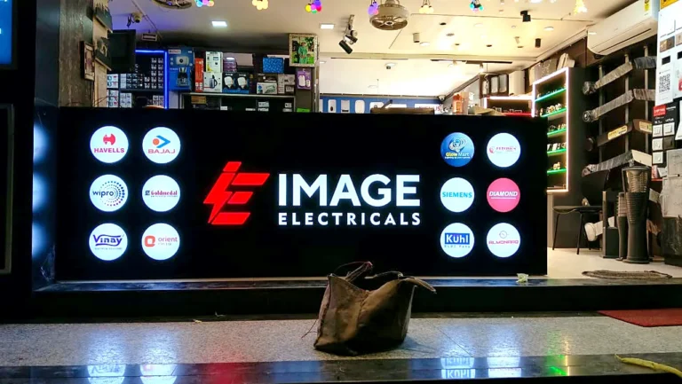 Image Electricals sales counter with a glowing logo board and brand logos