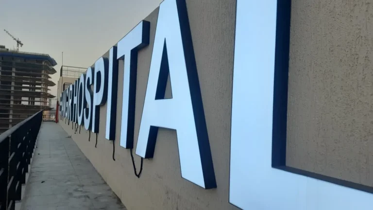HOSPITAL along the parapet at dusk, the Pune skyline behind
