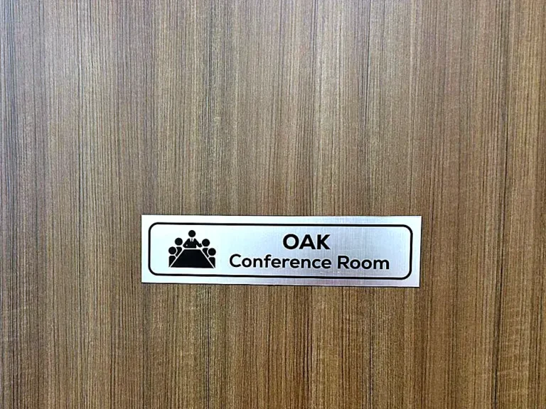 Silver laser-etched Oak conference room name plate
