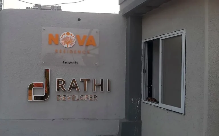 The same Nova gate wall by day, by the guard cabin