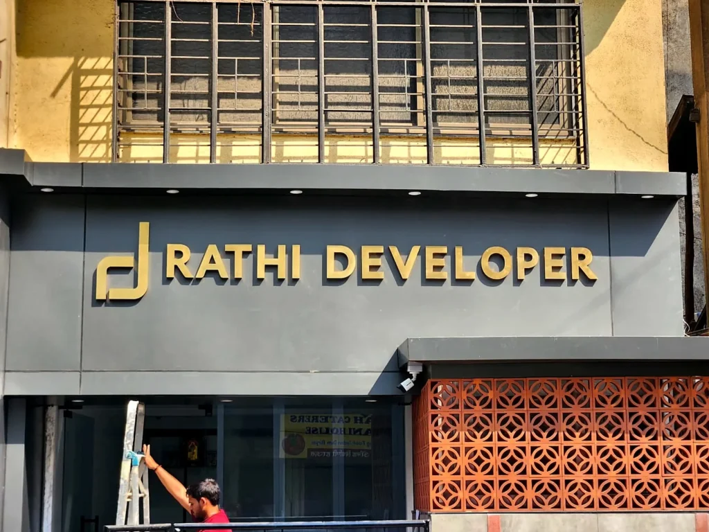 Rathi Developer’s office front in Kasba Peth: gold stainless steel letters on grey ACP