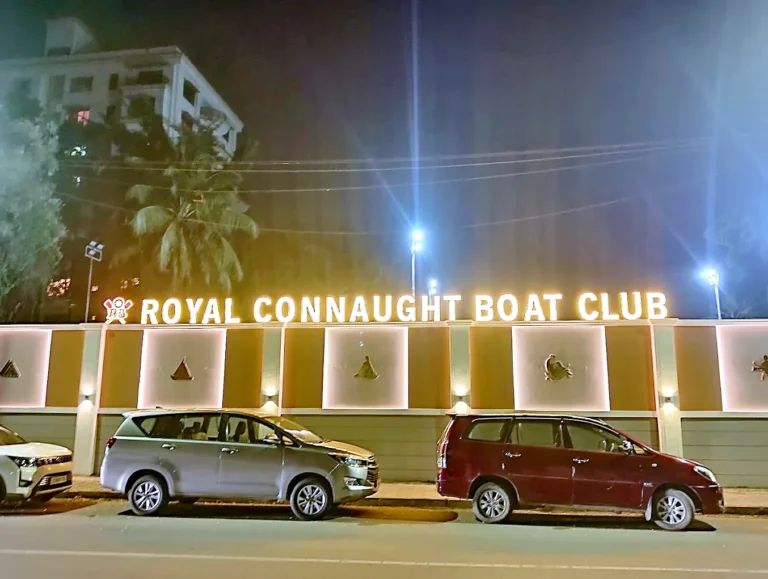 Royal Connaught Boat Club lit letters along the wall at night
