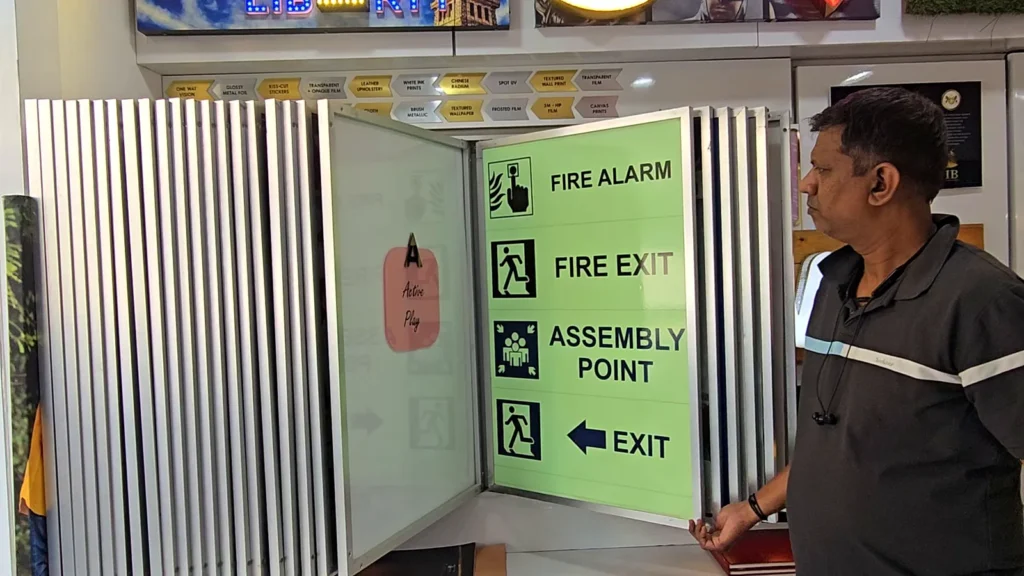 Sample panel of night-glow safety signs: fire alarm, fire exit, assembly point