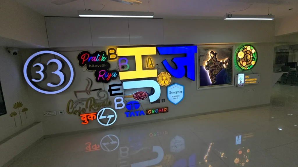 First-floor sample wall of LED, acrylic and metal letters and logos at Orchid Digitals