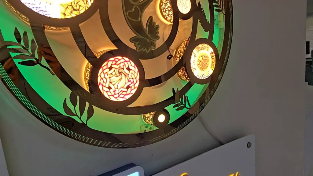 Laser-cut lit mandala artwork with coloured LED rings