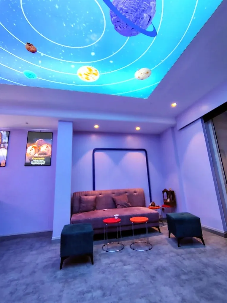 The seating area under the glowing 8 x 8 ft fabric light box in the ceiling